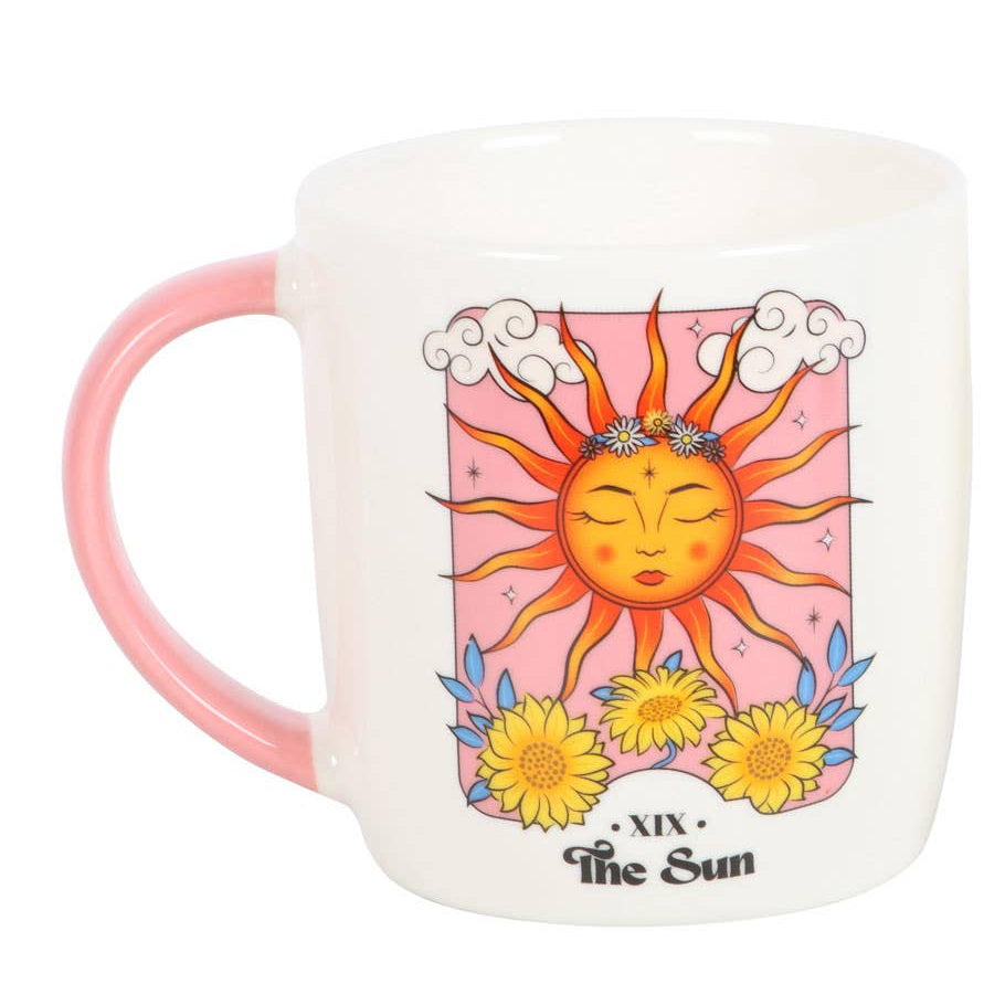 mugs with sun tarot card designs on a white background