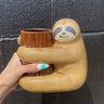 Sloth Hugging a Tree Planter