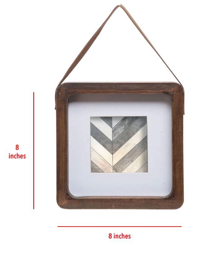 The hanging Picture frame fits a 4x4 inch photo and will add some interest to any home decor. The picture frame is hung from a leather strap and has a wooden frame.