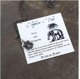 sterling silver necklace featuring an elephant and palm tree, handmade in Canada