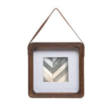 The hanging Picture frame fits a 4x4 inch photo and will add some interest to any home decor. The picture frame is hung from a leather strap and has a wooden frame.