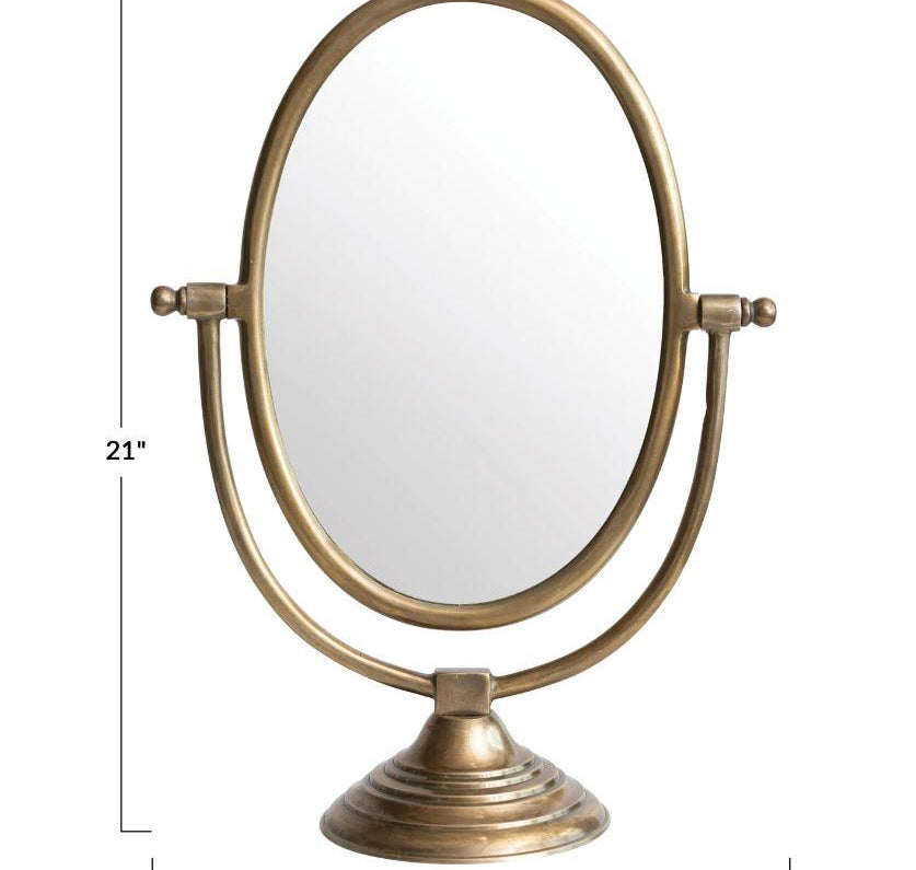 Oval Framed Mirror, The Oval Frame Mirror is perfect for your dresser or make up area, the mirror measures 21" tall by 7" wide and 15.5" long with an antiqued brass finish.