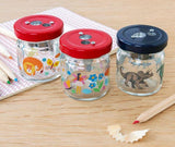 Wild Wonders Pencil Sharpener, keep those pencils and crayons sharp with this fun animal glass jar sharpener. Great for a child or even an adult who has a whimiscal sense of the world The glass jar sharpener features brightly colored safari type animals.