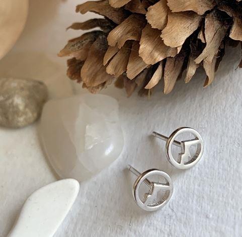 sterling silver earrings with a mountain scape in the centre, made in Canada