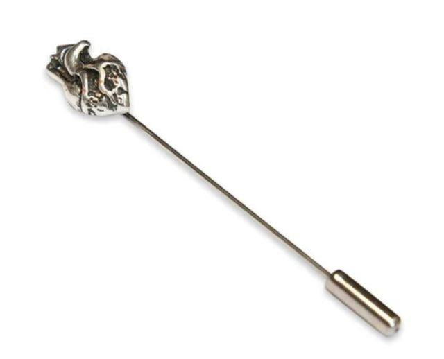 This ascot stickpin is exactly that. A metal 'stick' with an anatomical human heart adornment at the top and a 'clutch' at the bottom (to keep you from poking yourself and to keep your pin secure). It's one of the oldest styles of pins there is, often als