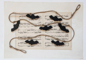 The Wooden Flying Bats Garland are made of mango wood and strung together with jute rope. The wall decor hangs 72" Long and is a great addition to any Halloween Decor or for an everyday touch of interest, surely a conversation starter in your home.