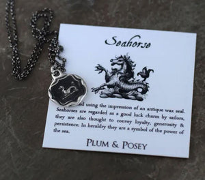 Seahorse Wax Seal Necklace is handmade in Canada with sterling silver. The jewelry is hypoallergenic and made from an antiqued wax seal. Sailors considered Seahorses a symbol of good luck