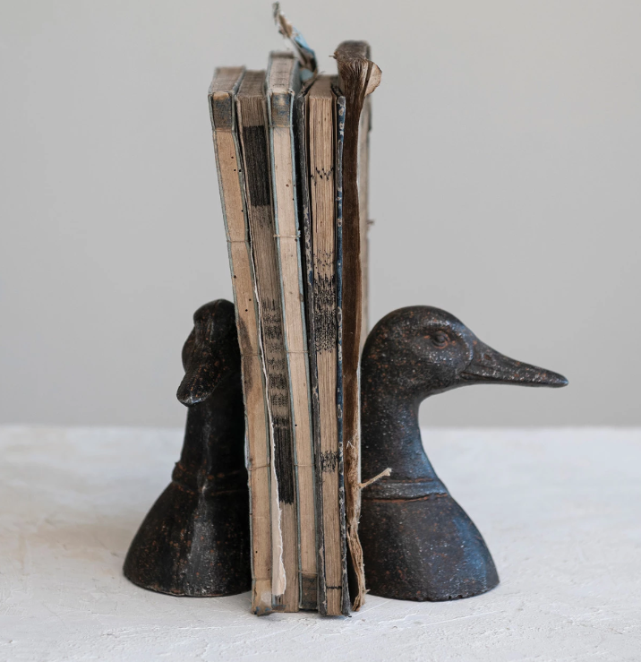 Duck Head Bookends, Add a touch of interest to your home with these Distressed Duck Head Bookends. The heavy duty bookends are made of cast iron and will keep your libary shelves looking organized and classy. 