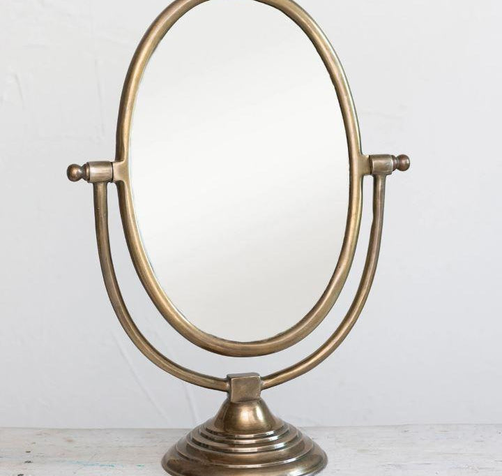 Oval Framed Mirror, The Oval Frame Mirror is perfect for your dresser or make up area, the mirror measures 21" tall by 7" wide and 15.5" long with an antiqued brass finish.