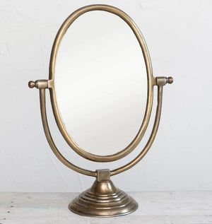 Oval Framed Mirror, The Oval Frame Mirror is perfect for your dresser or make up area, the mirror measures 21" tall by 7" wide and 15.5" long with an antiqued brass finish.